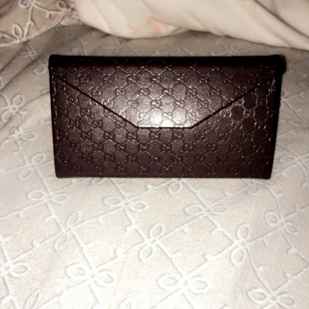 Gucci glasses case.